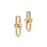 Gold hoop earrings on a white background