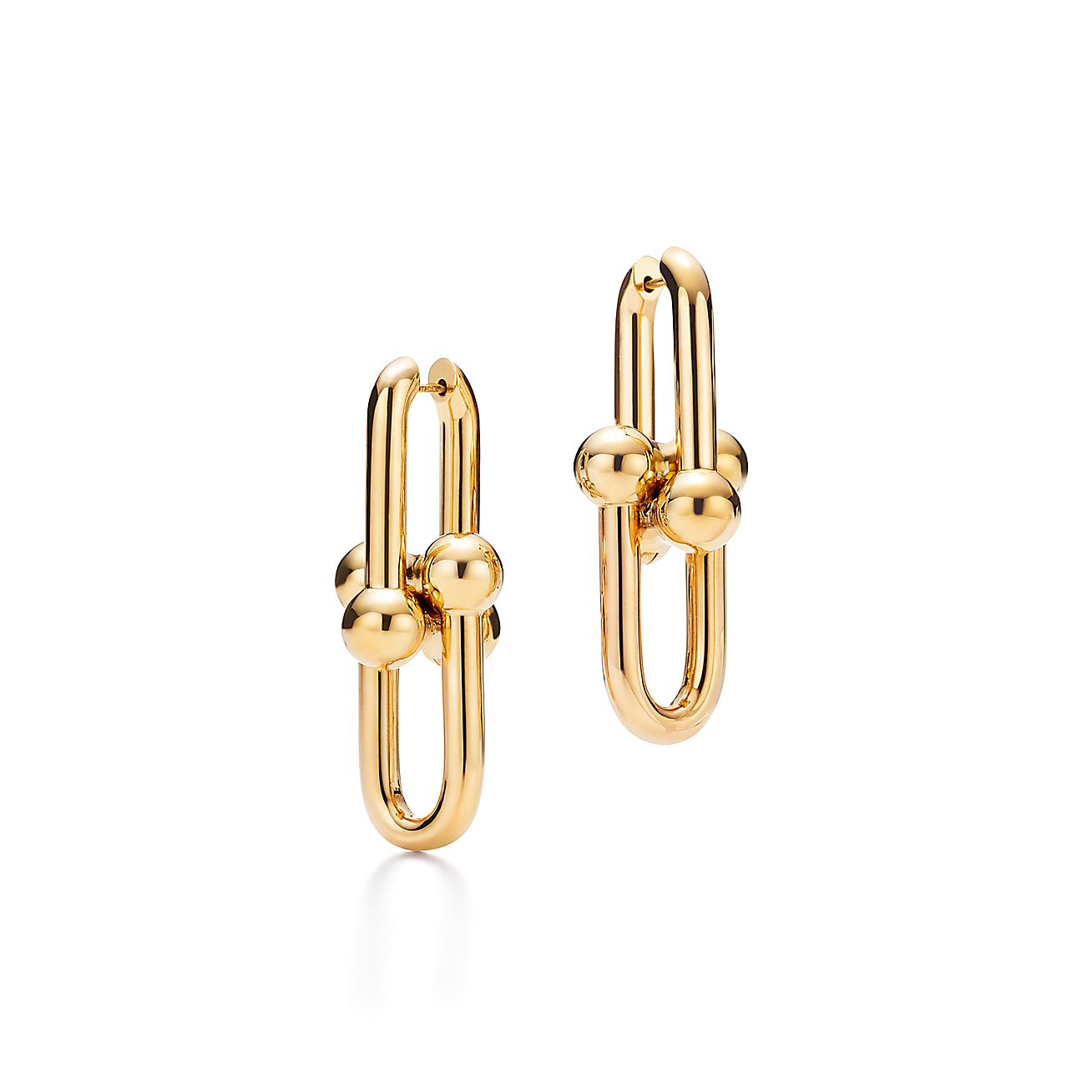 Gold hoop earrings on a white background