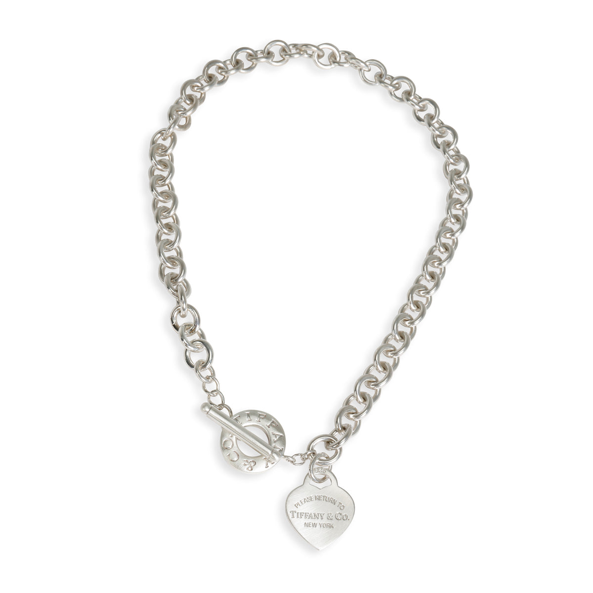 Silver chain bracelet with a heart-shaped tag on a white background