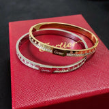 Cartier bracelets on a red box with a dark background