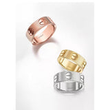 Three gold rings in different colors on a white background