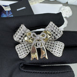 18K CC 25K Bow Tie Diamond Brooch